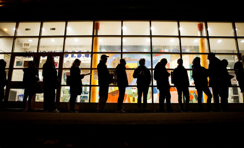 A line of voters stretches down the street as they wait for a polling site to open in New York, Tuesday, Nov. 8, 2016. (Photo: David Goldman/AP)